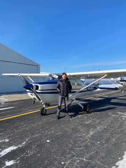 N4347R single engine plane with pilot posing