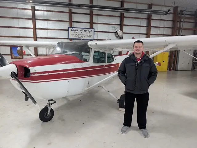 Cessna flying over Sundance Airport