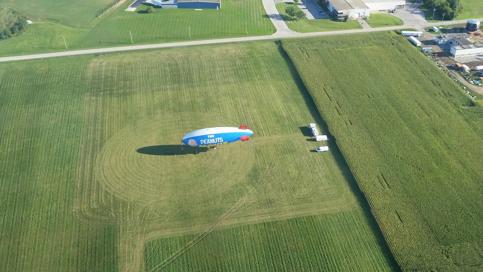 Small zeppelin over peanuts farm field