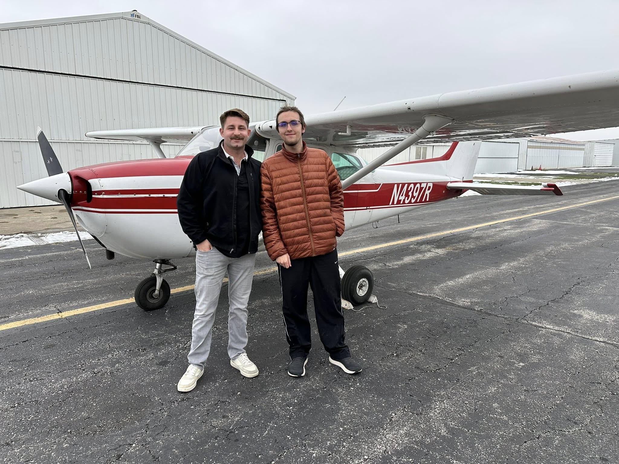 Eagle Aircraft instructor and student beside a Cessna training aircraft in Northwest Indiana